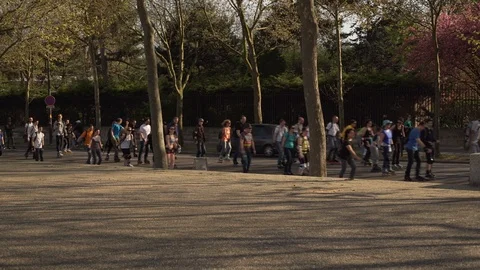 Large group of people rolling down the street in rollerblades, Paris, France Stock Footage 102425169