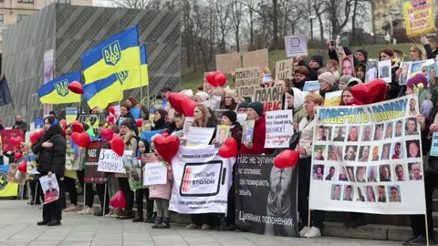 Large group of Ukrainian people with posters of their missing relatives Stock Footage 268803884