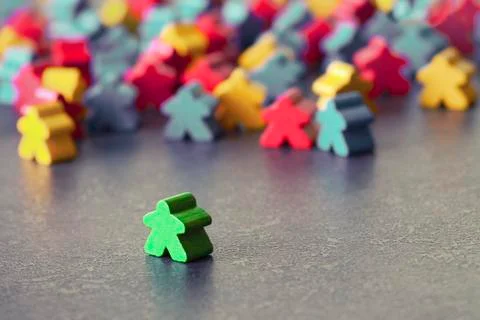 A large group of various figures does not accept a single person in their team. 스톡 사진