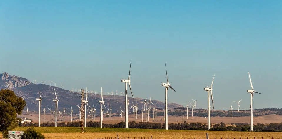 Large group of white wind generators produces alternative energy by wind Foto stock