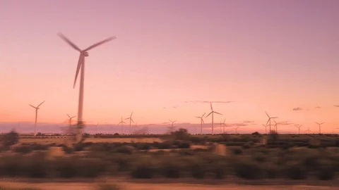 A large group of windmills running at sunset. Stock Footage 97471855