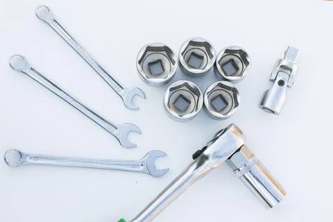Large group of wrenches, professional kit, different wrenches on the white ba Stock Photos