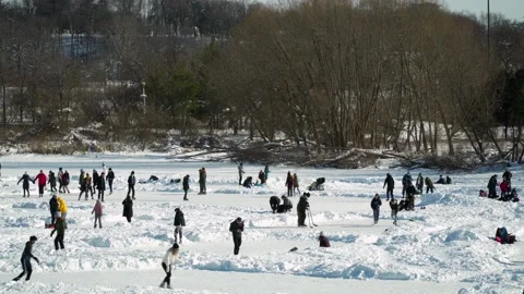 Large Groups Ice Skating On A Crowded Frozen Lake During COVID-19 Pandemic Stock Footage 148884971
