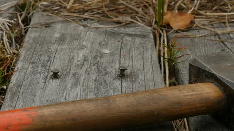 Large hammer on old weathered boards Stock Footage 119704576