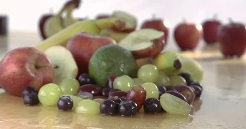 Large hand grabbing a selection of healthy fruit Video stock 69288479