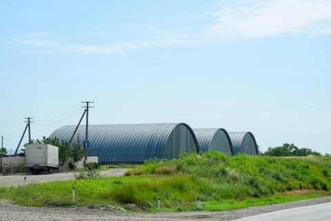 Large hangars made of galvanized corrugated a sheet iron. Stock Photos