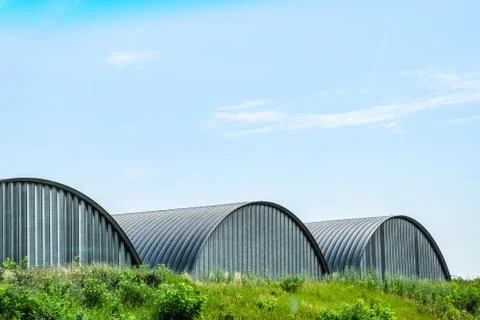 Large hangars made of galvanized corrugated a sheet iron. Stock Photos