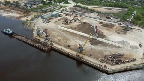 Large harbor cranes on the shore at the pier. Cargo port operation. Aerial Stock Footage 154195090
