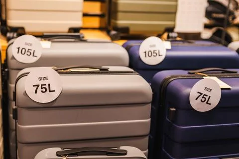 Large Hard Shell Suitcases With 75L and 105L Size Tags Фото