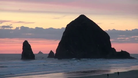 Large haystack rock at cannon beach in oregon Stock Footage 74090051