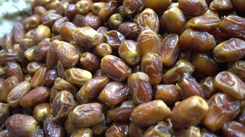 Large Heap of Sweet Dried Brown Dates Piled at Grocery Market Stall Stock Footage 340480428