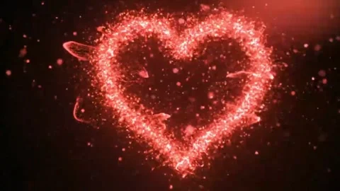 Large heart shape formed by countless glowing red particles. Stock Footage 316279602