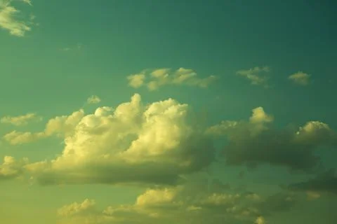 Large heavy clouds slowly float across blue beautiful sky. Stunning landscape Stock-Fotos