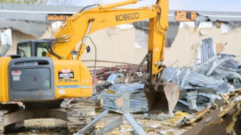 Large heavy construction machine moves metal pipe at demolition 스톡 동영상 125056876