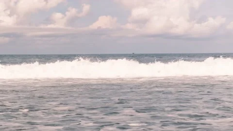 Large high foaming waves break off the coast of Bali island in Indonesia on a Video stock 195084701