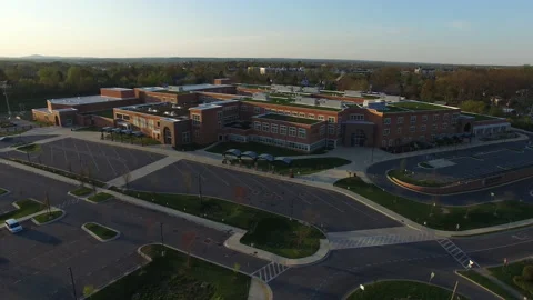 Large High School in Montgomery County, Maryland - Slow Rising Aerial Video stock 140724746
