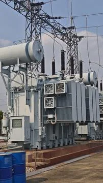 Large high voltage electrical power transformer with cooling fans. Stock Photos