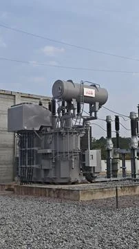 Large high voltage electrical power transformer with cooling fans . Stock Photos