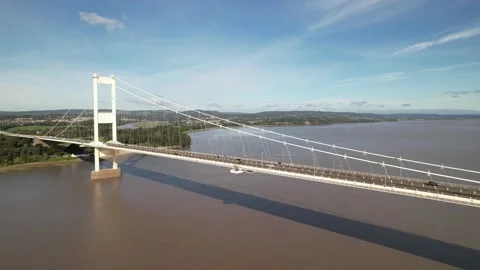 Large highway bridge over wide river estuary Stock Footage 166660308