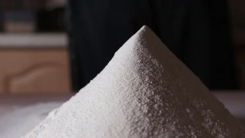 A large hill of sifted flour on the table Stock Footage 124960069