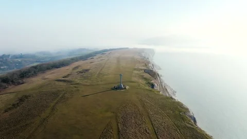 A large hillside with a lighthouse in the middle Stock Footage 303987693