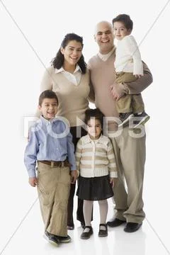 Large Hispanic family smiling Stock Photos