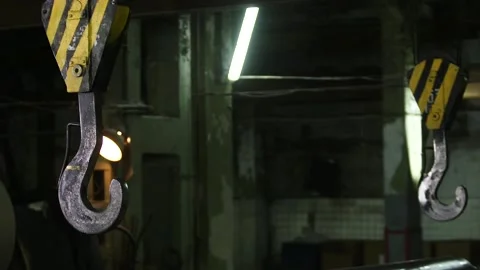 Large hooks of the crane approach the load. Video stock 140247203