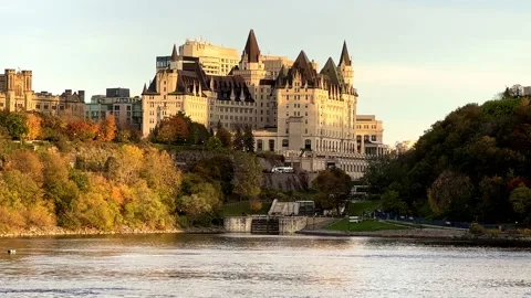 A large hotel building on the river Stock Footage 164122799
