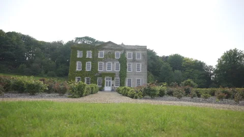 A large house with a garden in front of it Stock Footage 301794591