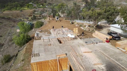 Large house under construction on a hilltop Stock-Footage 228794883