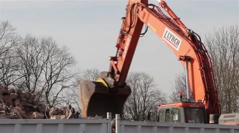 Large Hydraulic Digger Scoop &amp; Arm lifting Rubble - Construction Backgrounds Video stock 48992136