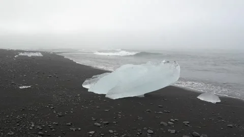 Large Ice Chunk on Black Sand Diamond Beach in Iceland During Foggy Weather Stock Footage 339951782