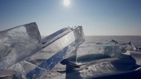 Large ice cubes on seashore, ice figure show and art, amazing natural landscape Stock Footage 191612209