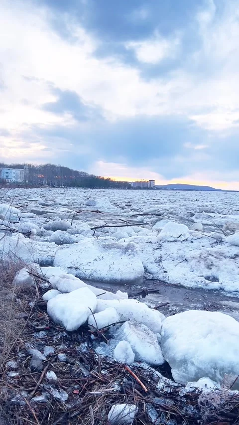 Large Ice Floes Break Apart on Songhua River at Sunset in Harbin Stock Footage 337330974