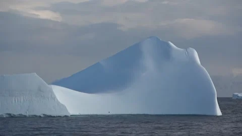 Large iceberg drifting wide ocean Antarctica, 4K Stock Footage 332372843