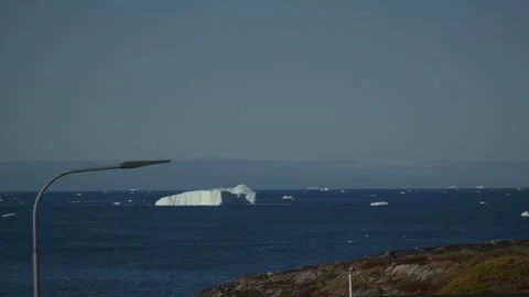 Large Iceberg Floating Off Ilulissat Coast in Greenland Slow Motion Stock Footage 345453442