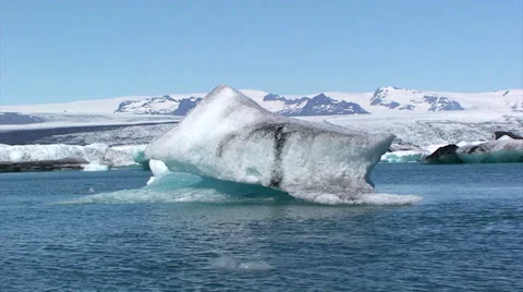 Large iceberg in front of the shore blocks view to glacier Stock Footage 37972441