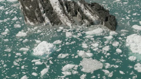 Large iceberg with smaller icebergs floating near Columbia Glacier, Alaska Video stock 230962690