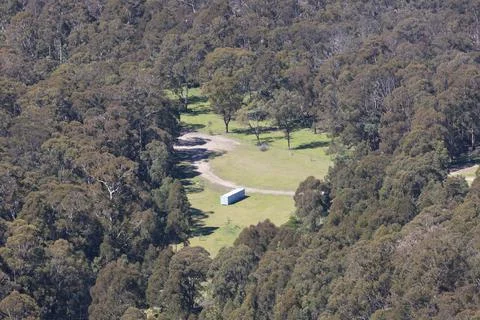 A large implement shed in a valley in regional Australia Stock Photos