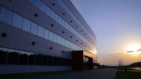 A large industrial building at sunset Stock Footage 66901469