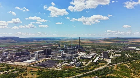 Large industrial complex located in a valley with mountains in the background Stock Footage 341100353