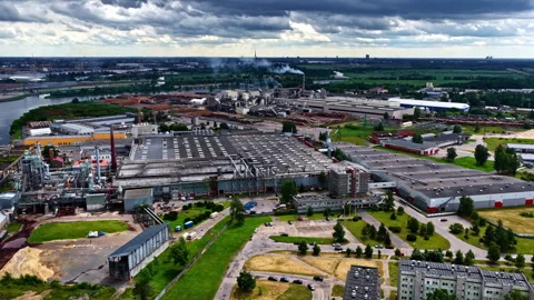 A Large Industrial Complex with Multiple Factories and Warehouses is Shown Stock Footage 314482936