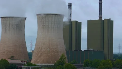 Large industrial complex with several tall buildings and towers nuclear Stock Footage 250764401