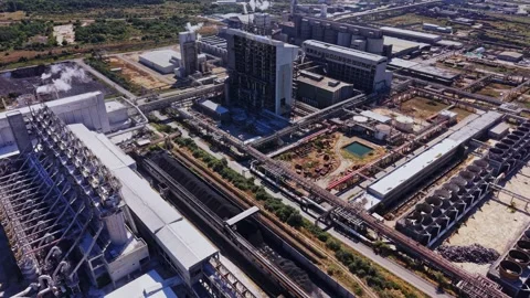 Large industrial complex with warehouses and equipment in a city Stock Footage 339648346