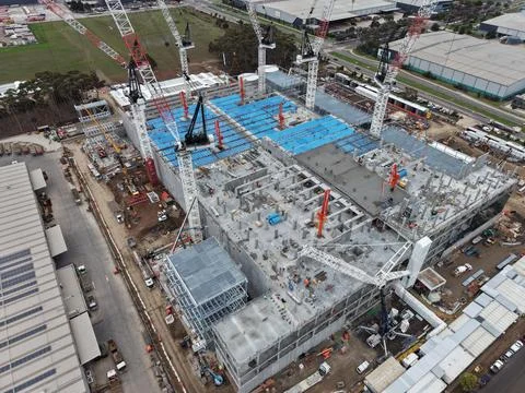 Large industrial construction site with multiple tower cranes Stock Photos