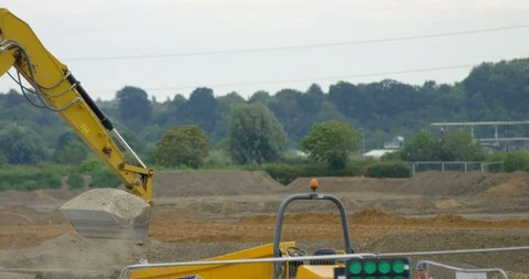 Large Industrial Crane on a Construction Site. Yellow Moving Digger on Quarry Stock Footage 94717779