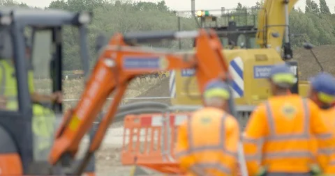 Large Industrial Crane Digger and Workmen on British Construction Site.  Stock Footage 94709645