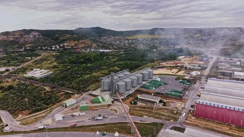 A large industrial facility is seen from above Stock Footage 339650295