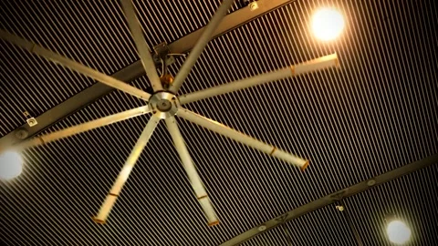 Large Industrial High Volume Ceiling Fan Rotating in Modern Interior Video stock 341981235