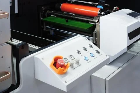 Large industrial offset printing machine prints an image on packaging film. t Stock Photos